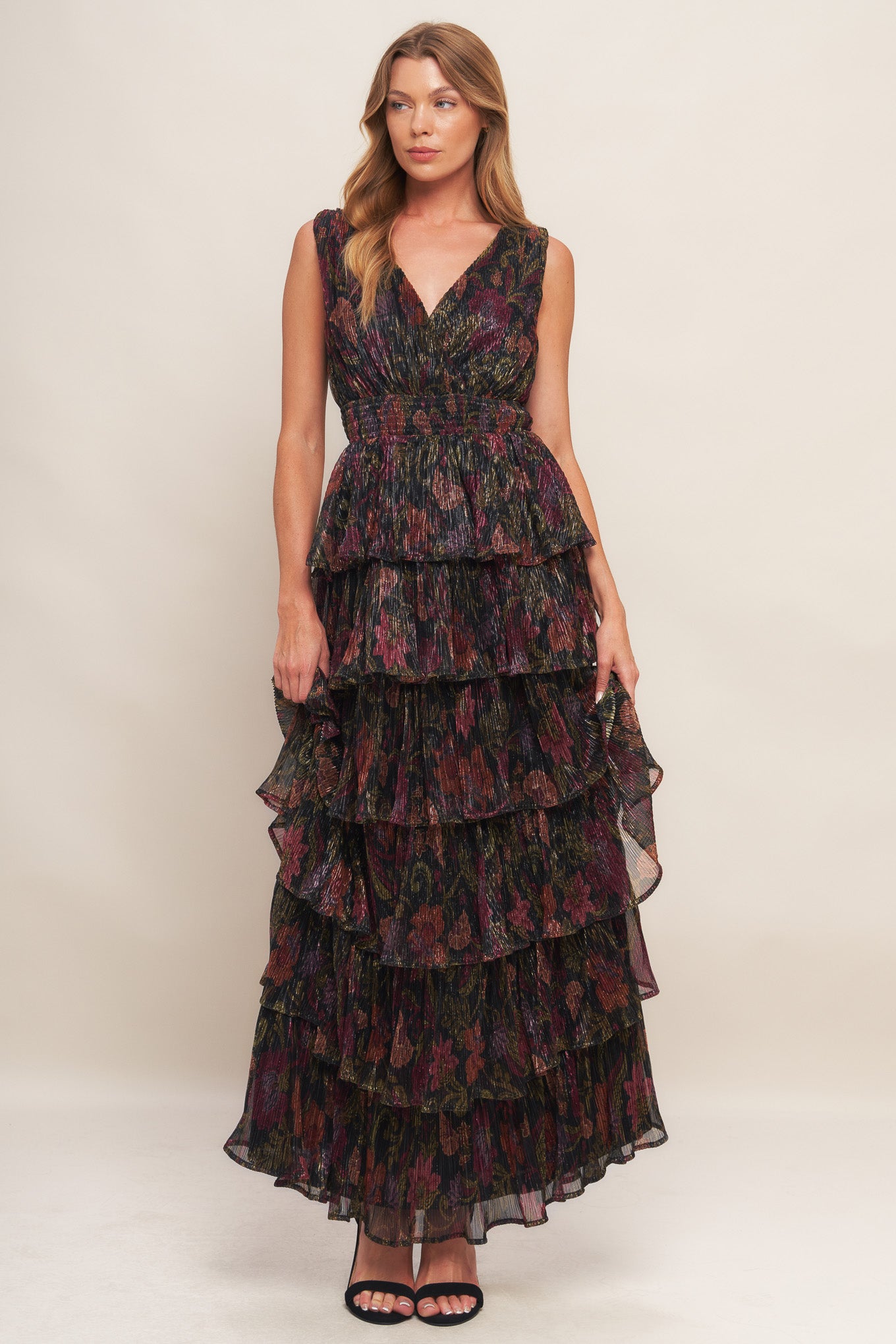 A woven micro-pleated maxi dress featuring surplice neckline, sleeveless, smocked waistband and layered skirt