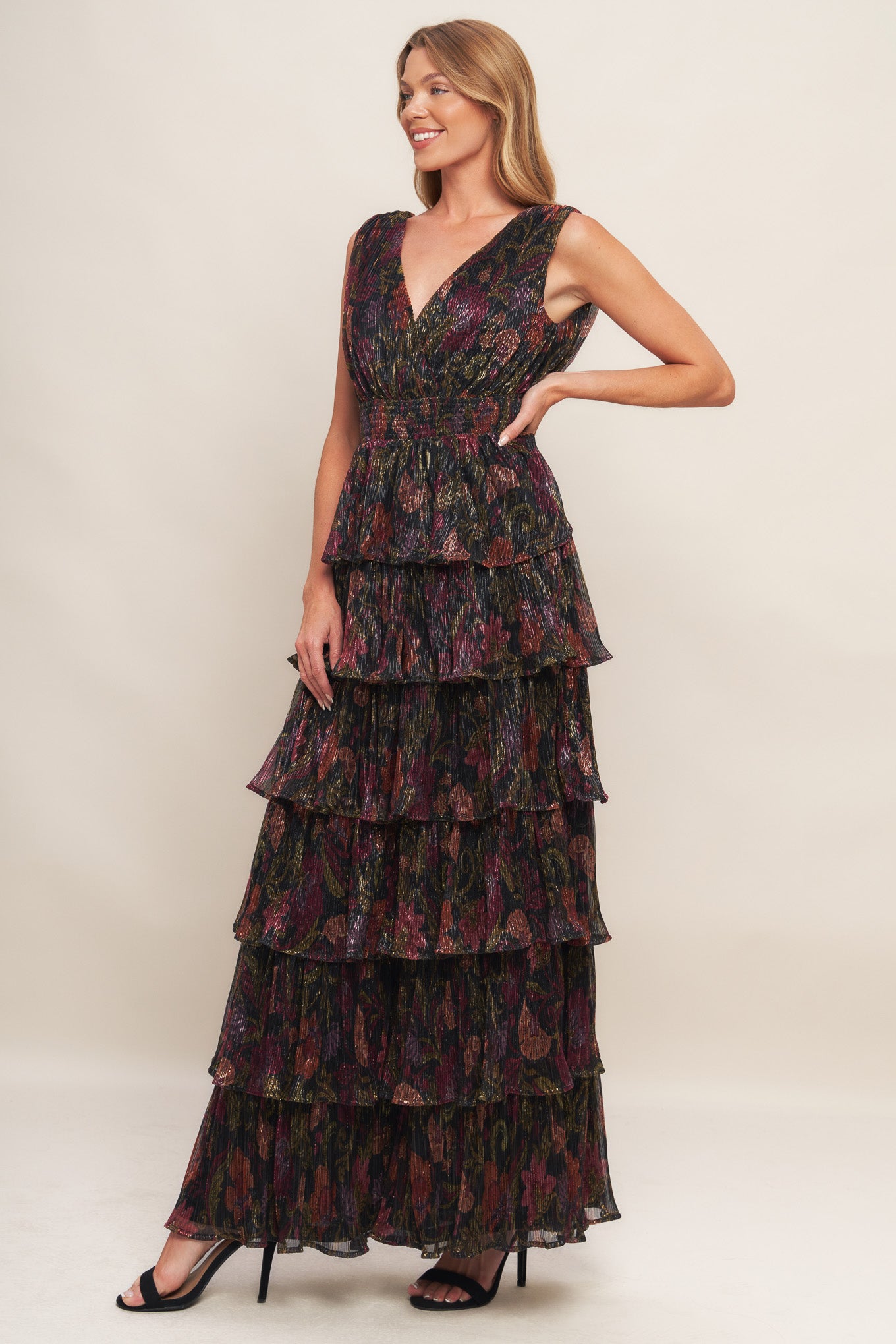 A woven micro-pleated maxi dress featuring surplice neckline, sleeveless, smocked waistband and layered skirt
