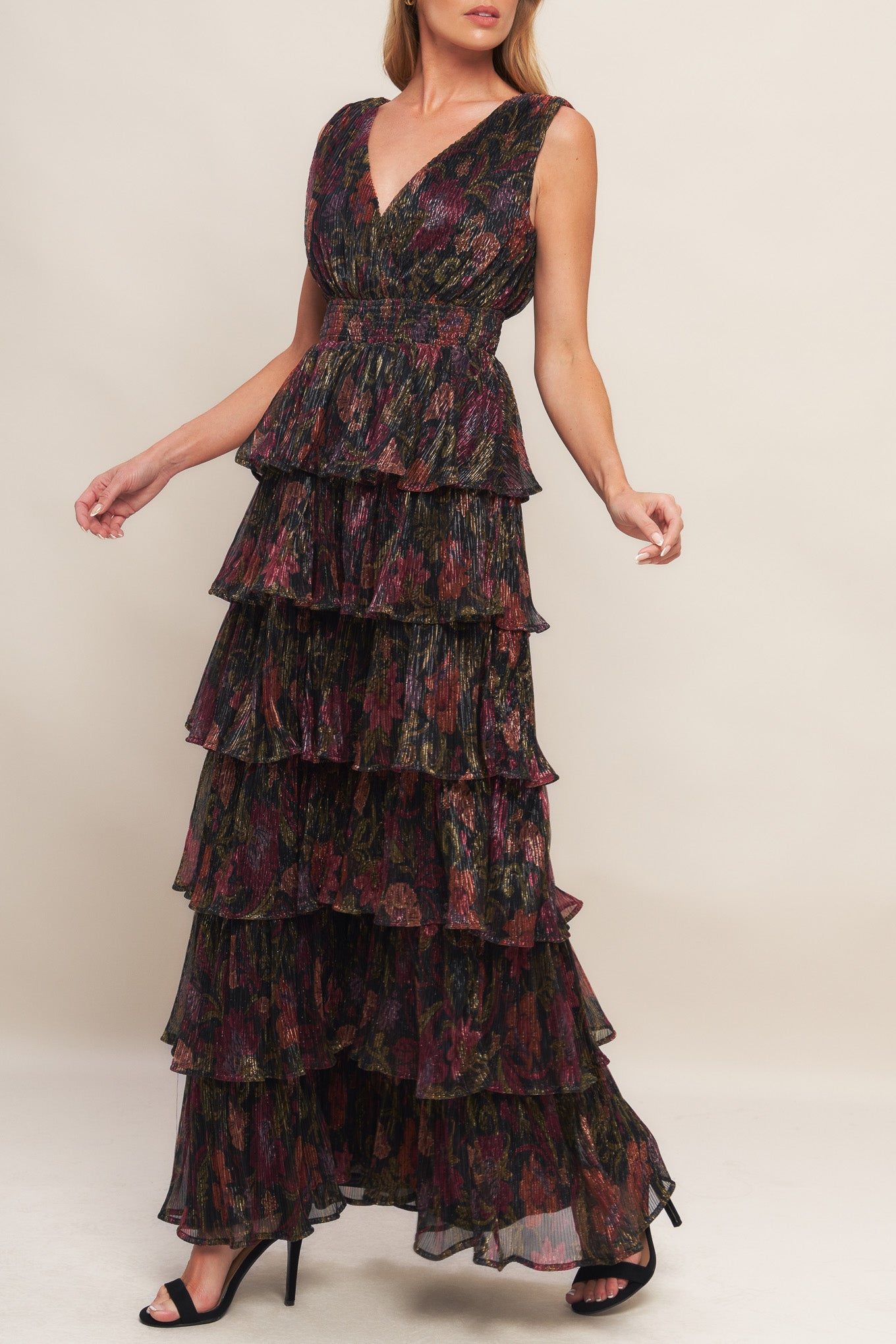 A woven micro-pleated maxi dress featuring surplice neckline, sleeveless, smocked waistband and layered skirt