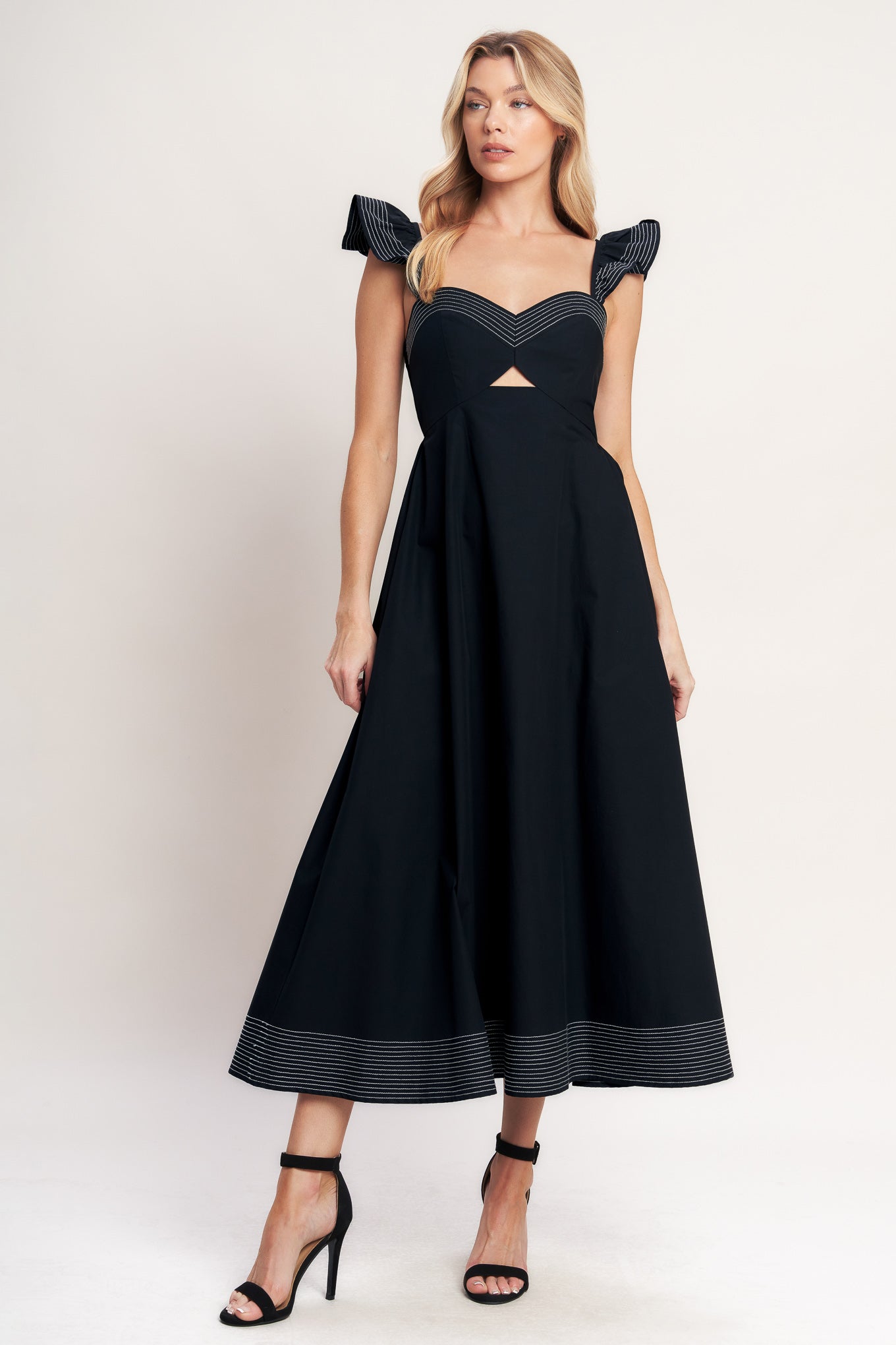 A solid woven midi dress featuring sweetheart neckline, flutter sleeve, center front cut out, circle skirt and smocked back bodice

Details:

Self: 100% Cotton

Size & Fit

-Model is 5`8" And Wearing Size Small
-Measurements Taken From Size Small
-Approx. Length: 51"