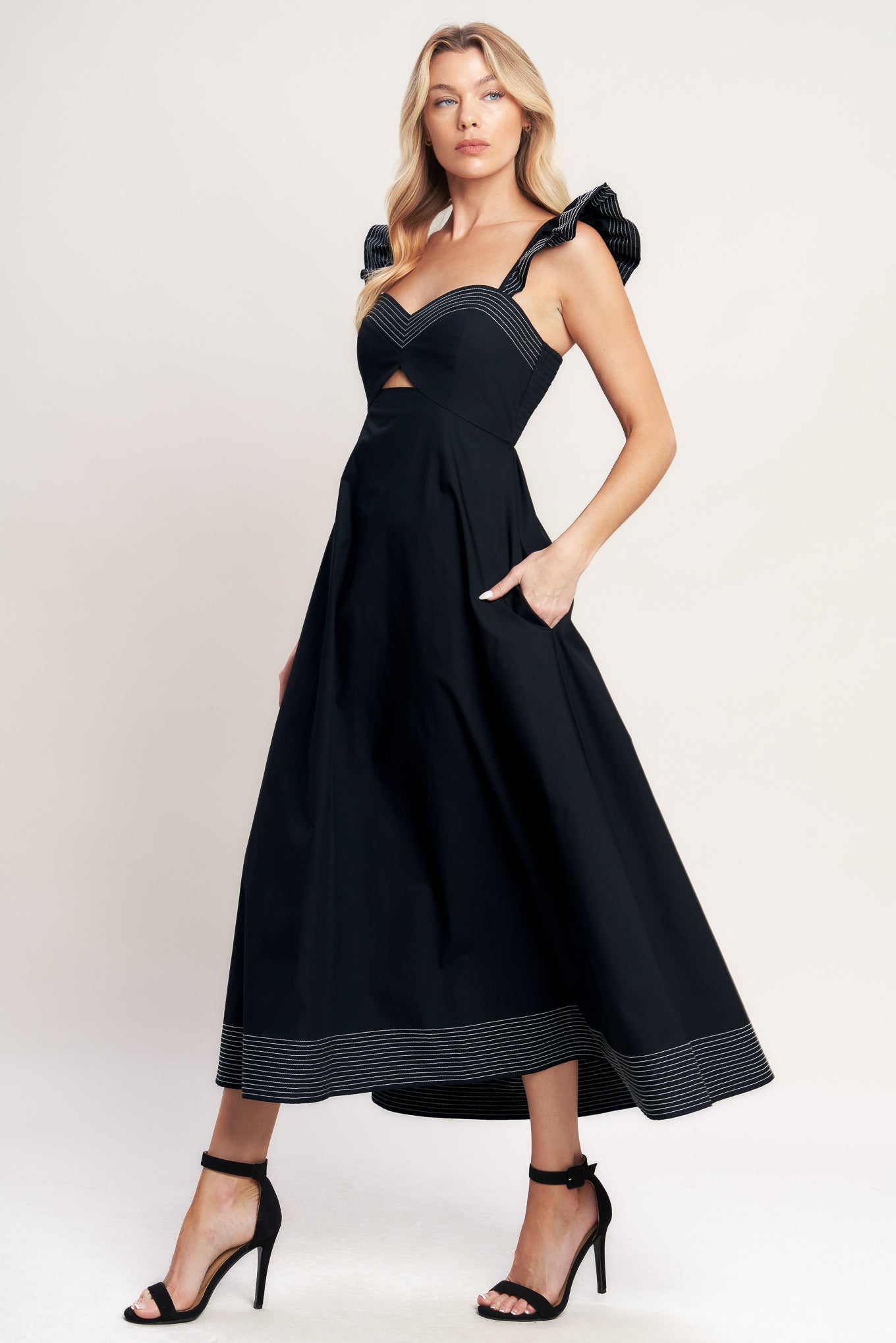 A solid woven midi dress featuring sweetheart neckline, flutter sleeve, center front cut out, circle skirt and smocked back bodice

Details:

Self: 100% Cotton

Size & Fit

-Model is 5`8" And Wearing Size Small
-Measurements Taken From Size Small
-Approx. Length: 51"