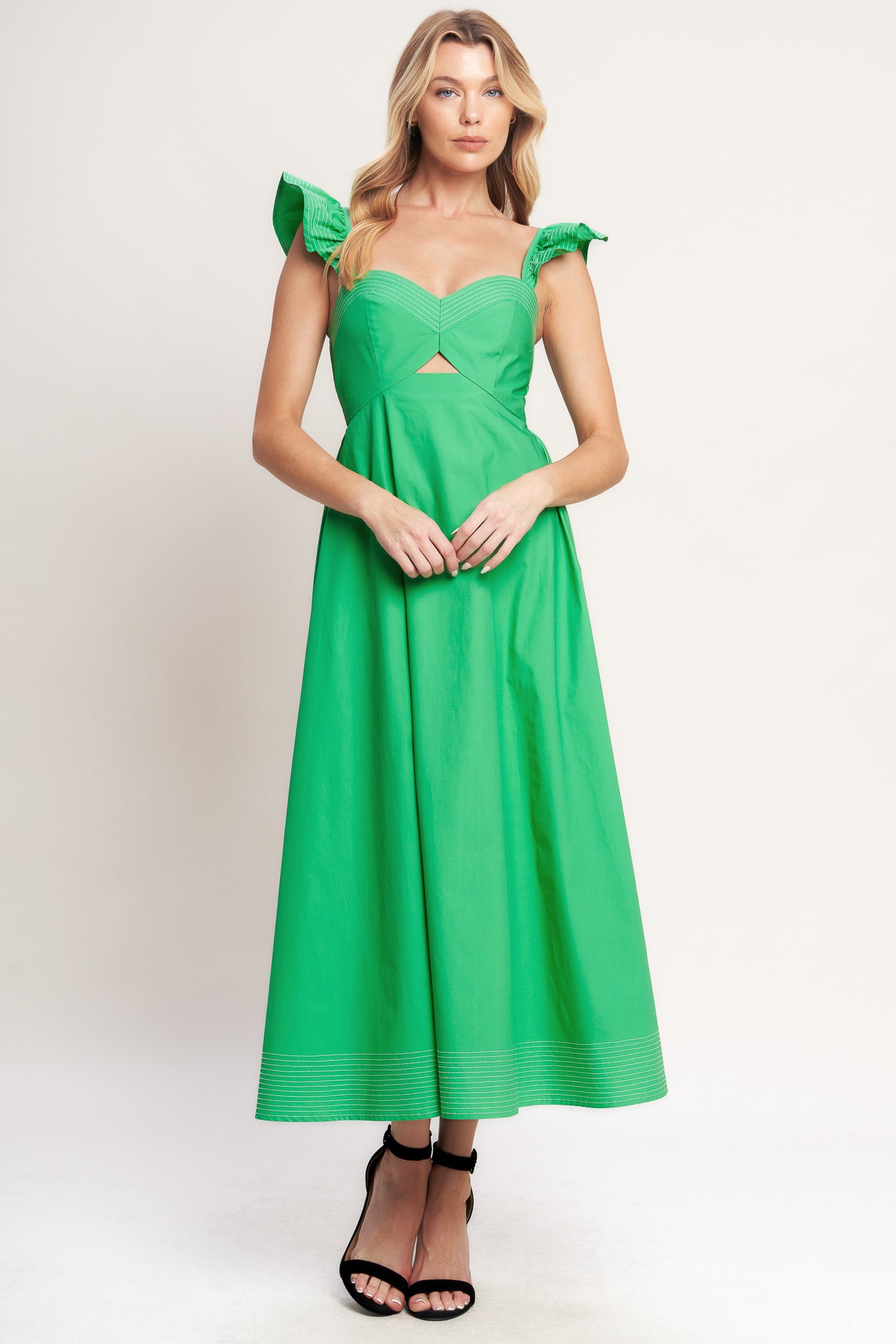 A solid woven midi dress featuring sweetheart neckline, flutter sleeve, center front cut out, circle skirt and smocked back bodice

Details:

Self: 100% Cotton

Size & Fit

-Model is 5`8" And Wearing Size Small
-Measurements Taken From Size Small
-Approx. Length: 51"