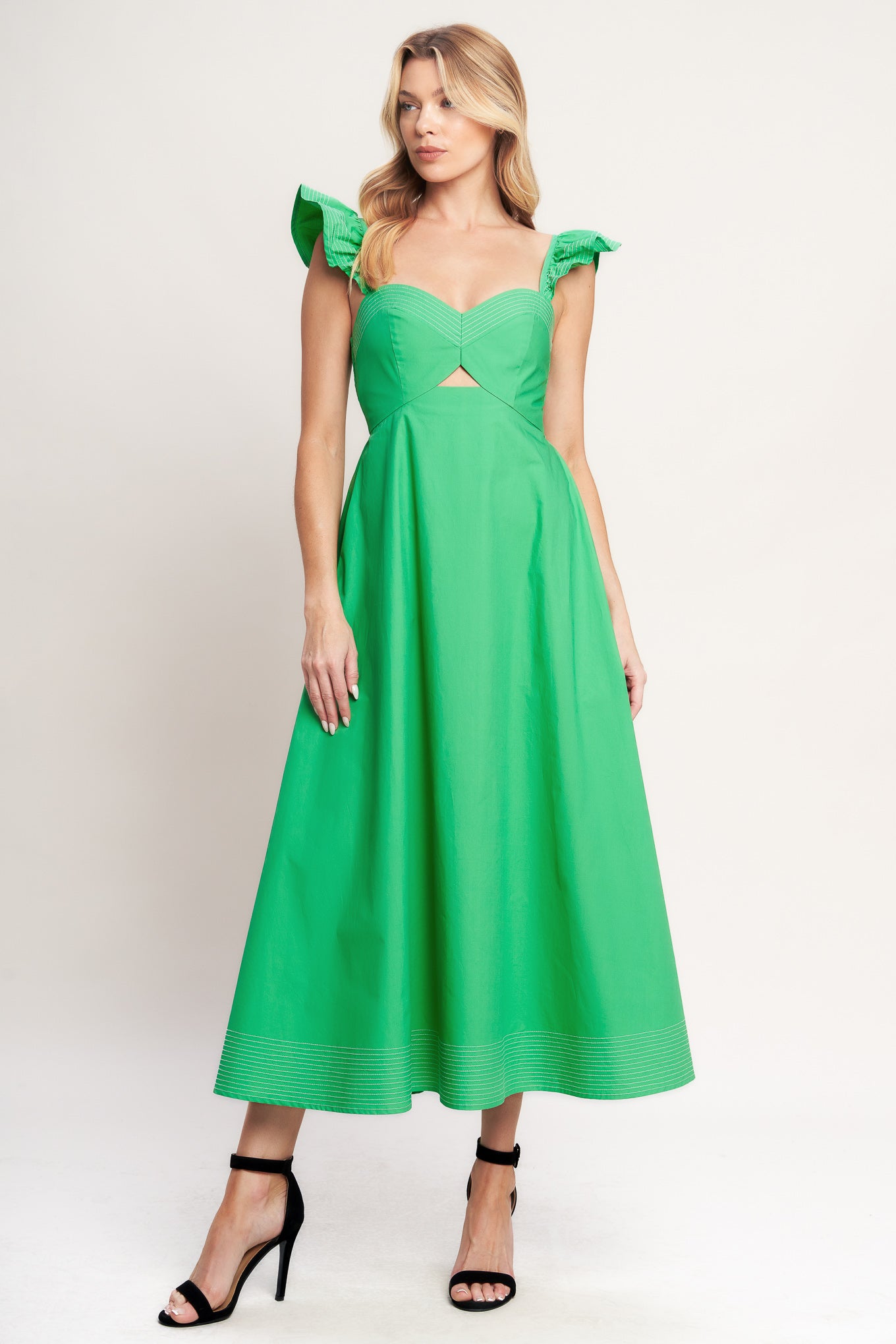 A solid woven midi dress featuring sweetheart neckline, flutter sleeve, center front cut out, circle skirt and smocked back bodice

Details:

Self: 100% Cotton

Size & Fit

-Model is 5`8" And Wearing Size Small
-Measurements Taken From Size Small
-Approx. Length: 51"