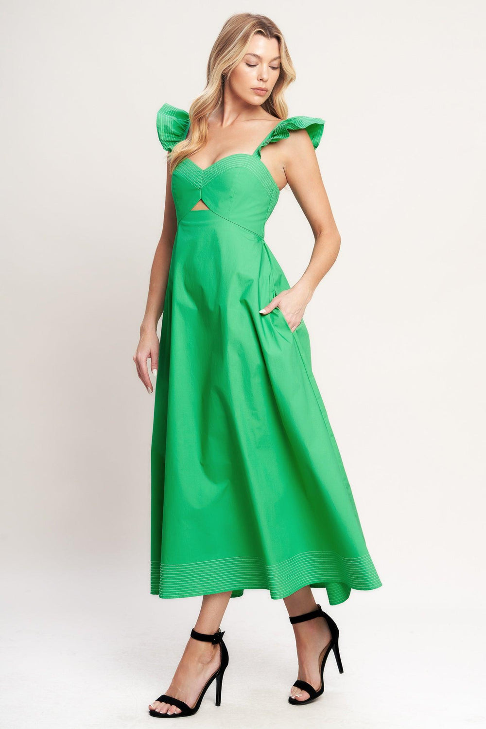 A solid woven midi dress featuring sweetheart neckline, flutter sleeve, center front cut out, circle skirt and smocked back bodice

Details:

Self: 100% Cotton

Size & Fit

-Model is 5`8" And Wearing Size Small
-Measurements Taken From Size Small
-Approx. Length: 51"