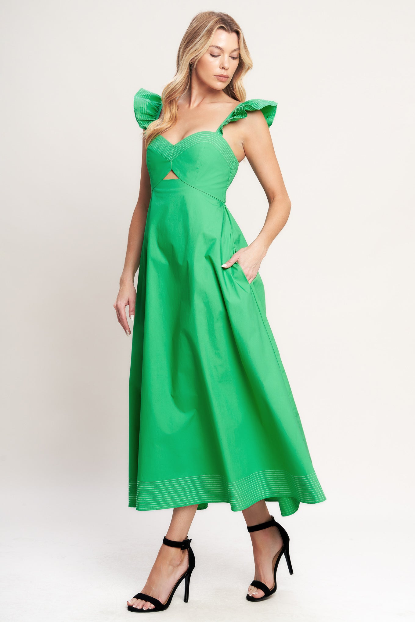 A solid woven midi dress featuring sweetheart neckline, flutter sleeve, center front cut out, circle skirt and smocked back bodice

Details:

Self: 100% Cotton

Size & Fit

-Model is 5`8" And Wearing Size Small
-Measurements Taken From Size Small
-Approx. Length: 51"