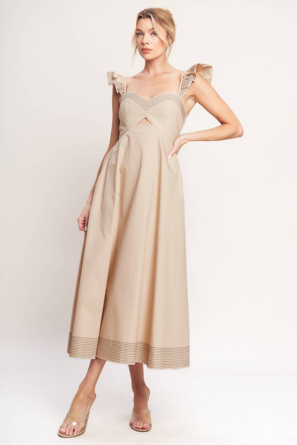 A solid woven midi dress featuring sweetheart neckline, flutter sleeve, center front cut out, circle skirt and smocked back bodice

Details:

Self: 100% Cotton

Size & Fit

-Model is 5`8" And Wearing Size Small
-Measurements Taken From Size Small
-Approx. Length: 51"