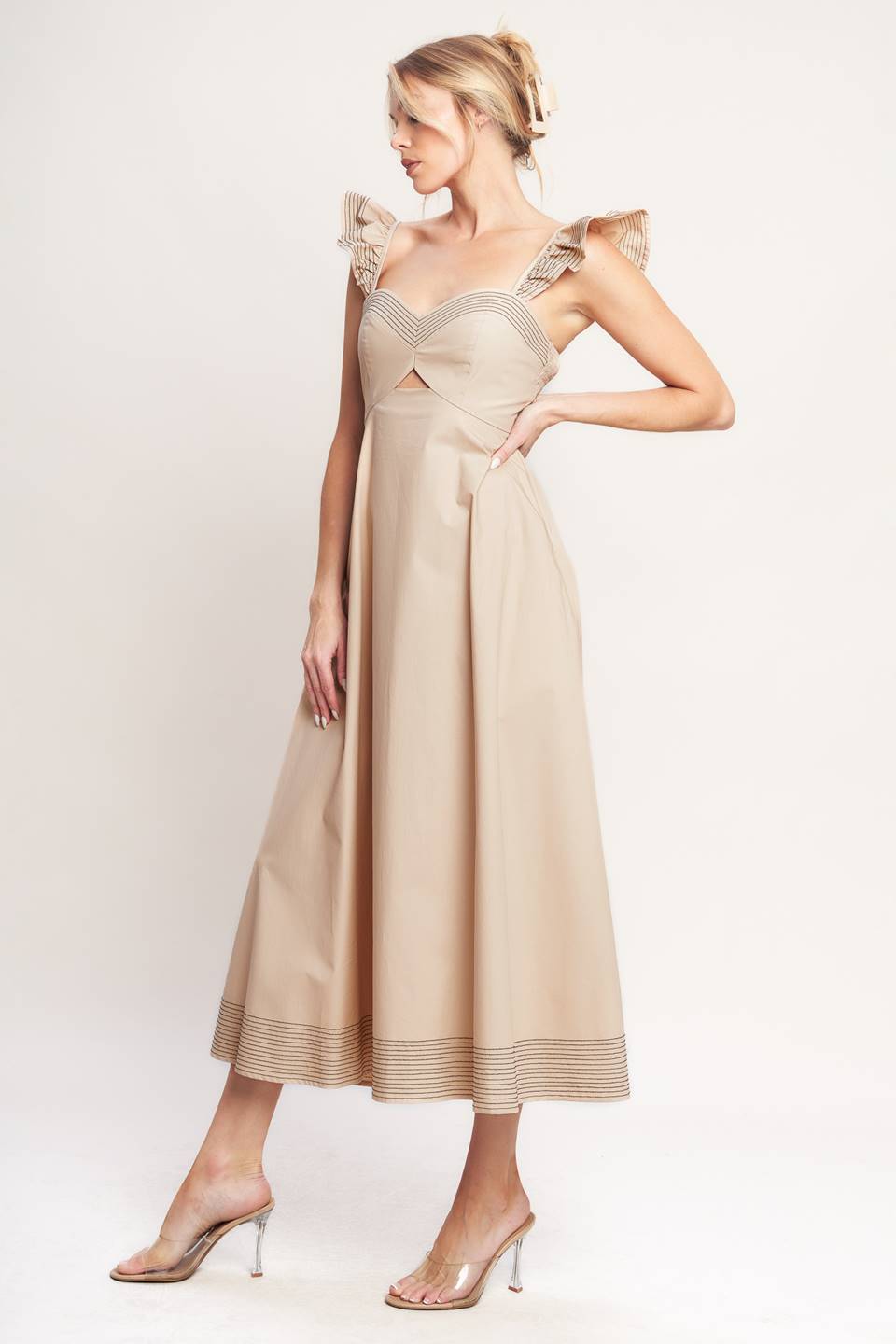 A solid woven midi dress featuring sweetheart neckline, flutter sleeve, center front cut out, circle skirt and smocked back bodice

Details:

Self: 100% Cotton

Size & Fit

-Model is 5`8" And Wearing Size Small
-Measurements Taken From Size Small
-Approx. Length: 51"