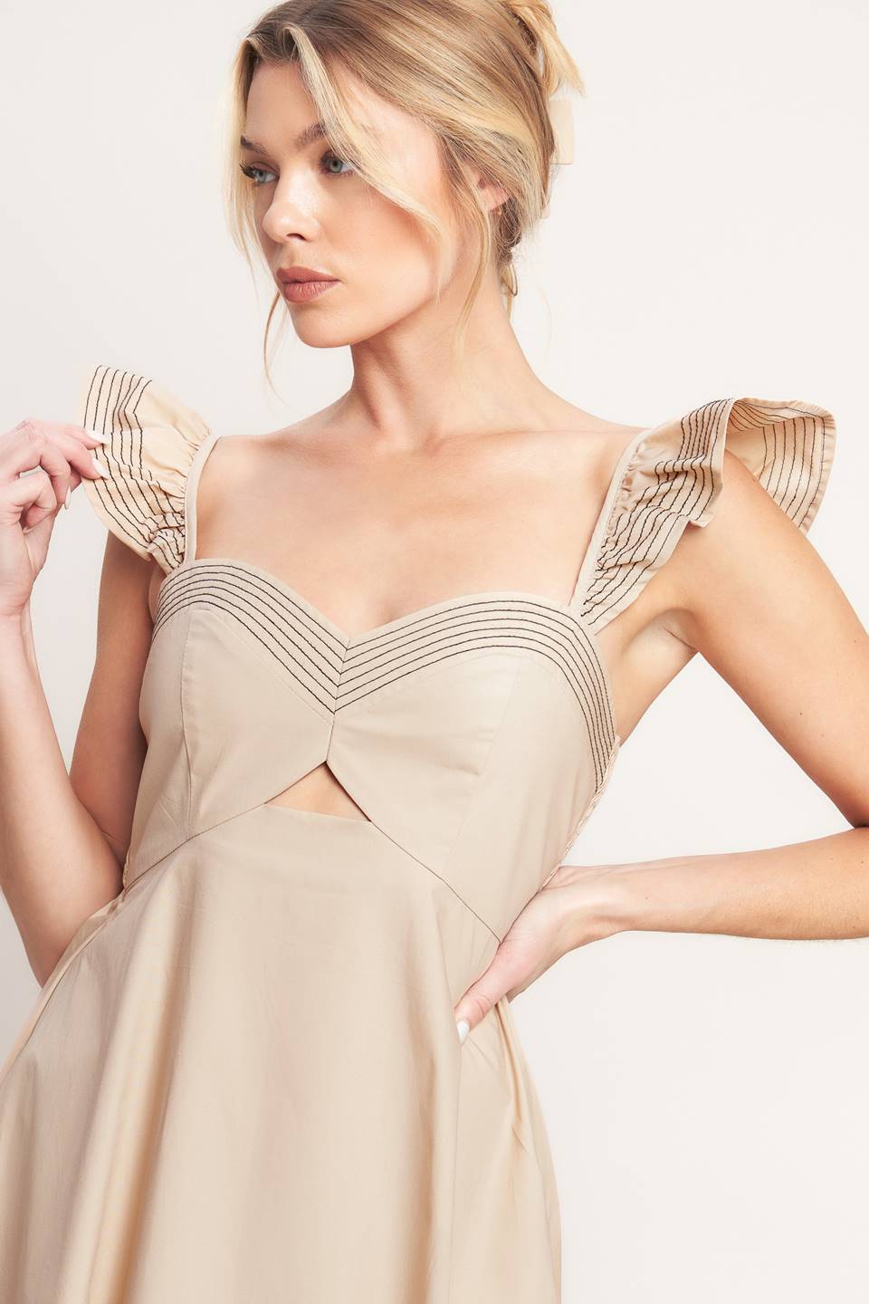 A solid woven midi dress featuring sweetheart neckline, flutter sleeve, center front cut out, circle skirt and smocked back bodice

Details:

Self: 100% Cotton

Size & Fit

-Model is 5`8" And Wearing Size Small
-Measurements Taken From Size Small
-Approx. Length: 51"