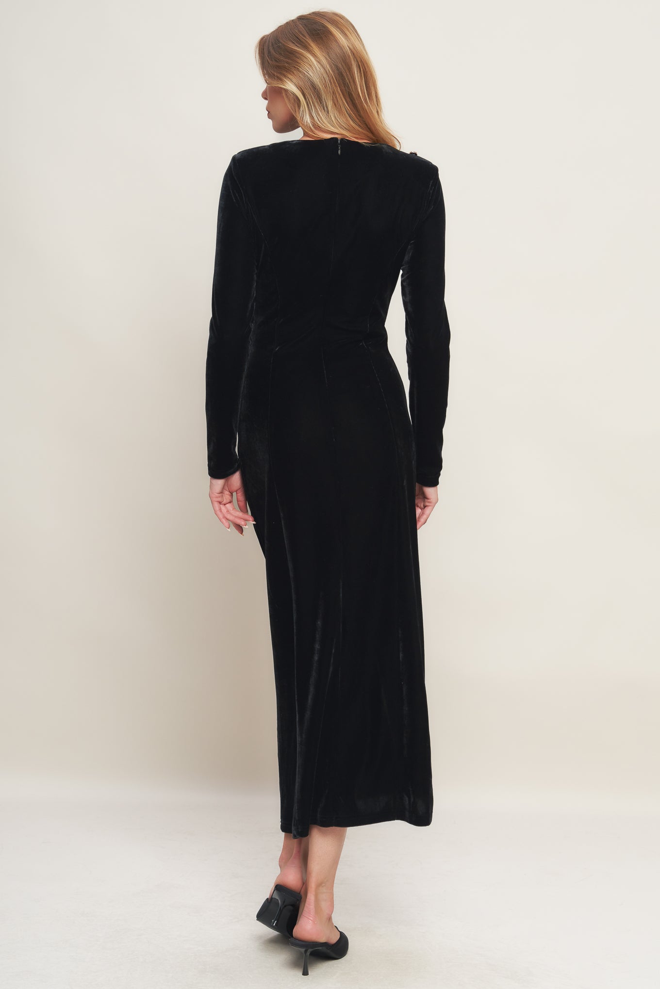 A solid velvet midi dress featuring round neckline long sleeve, side pearl button down and back zipper closure