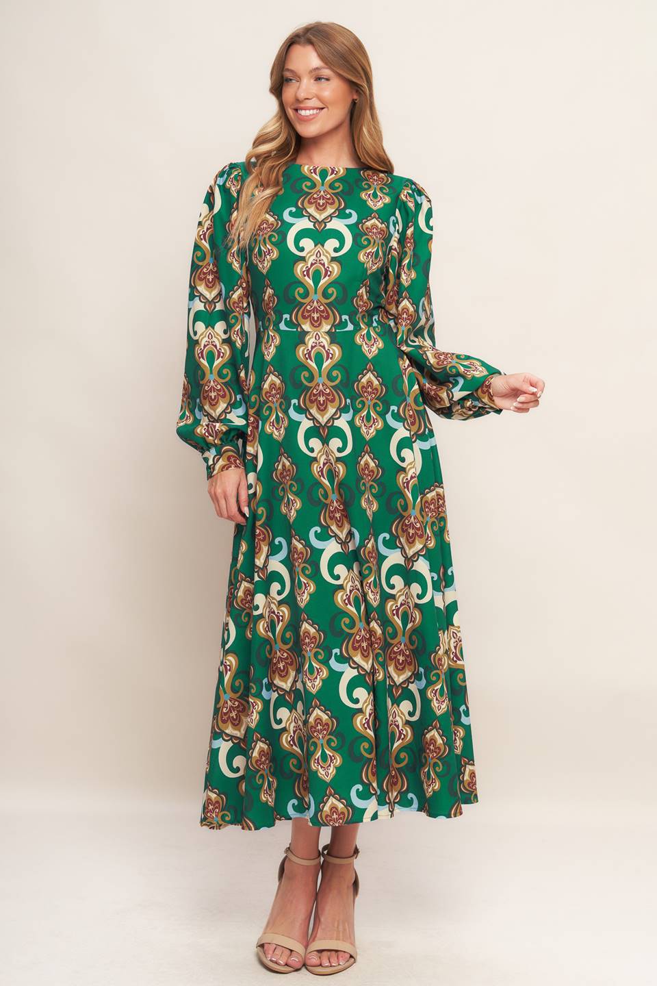 
A printed woven midi dress featuring round neckline, long sleeve with cuff, circle skirt, back cut out with tie and zipper closure