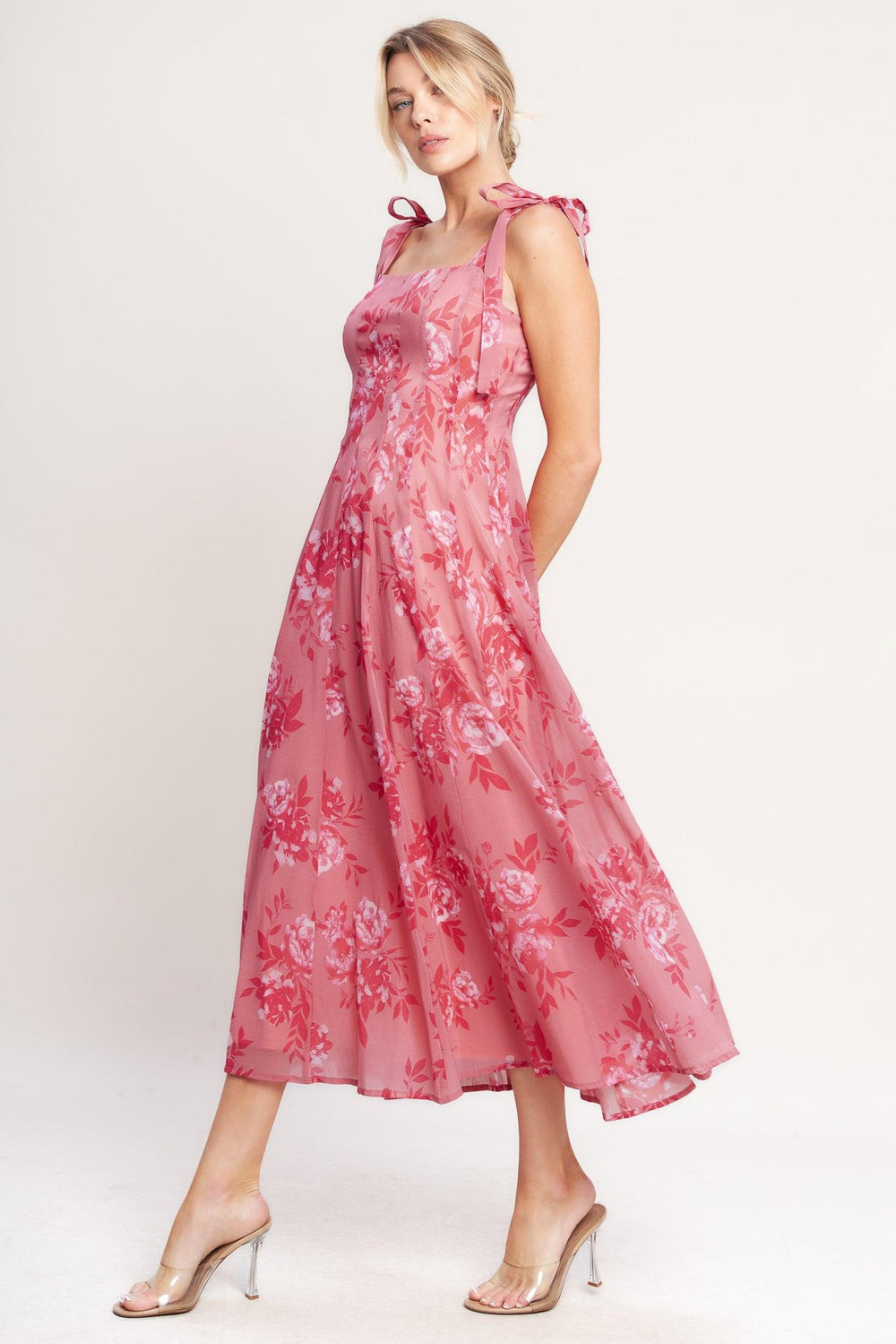 A printed woven midi dress featuring square neckline, shoulder tie, circle skirt and back zipper closure

Details:

Self: 100% Polyester

Lining: 100% Polyester

Size & Fit

-Model is 5`8" And Wearing Size Small
-Measurements Taken From Size Small
-Approx. Length: 53"