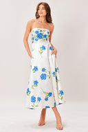 Woman wearing a strapless floral printed woven midi dress featuring strapless, circle skirt and back zipper closure 