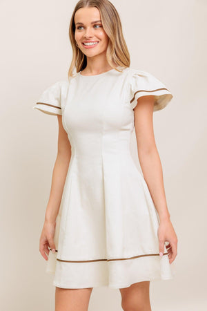 A solid woven mini dress featuring round neckline, short flutter sleeve, circle skirt and back zipper closure
