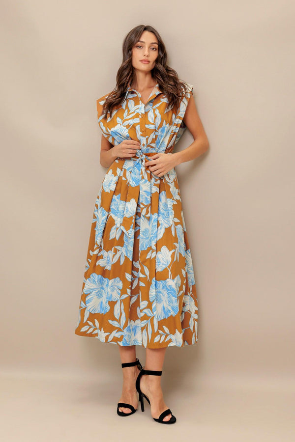 A printed woven midi dress featuring collar, short sleeve, front button down, self sash tie and full skirt