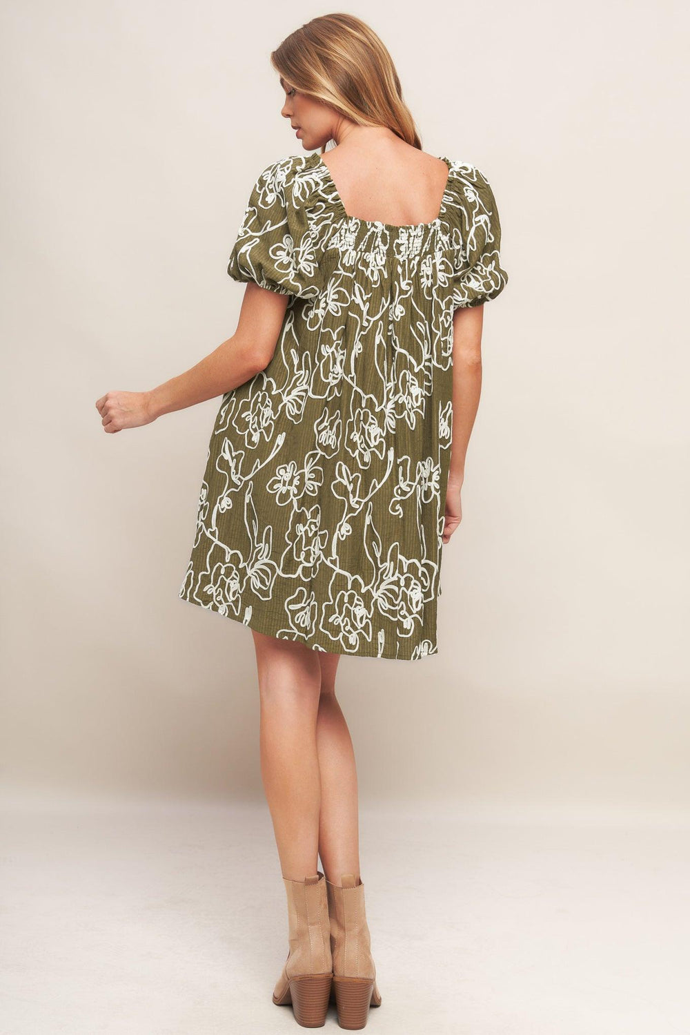 A textured woven mini dress with square neckline and short sleeve
