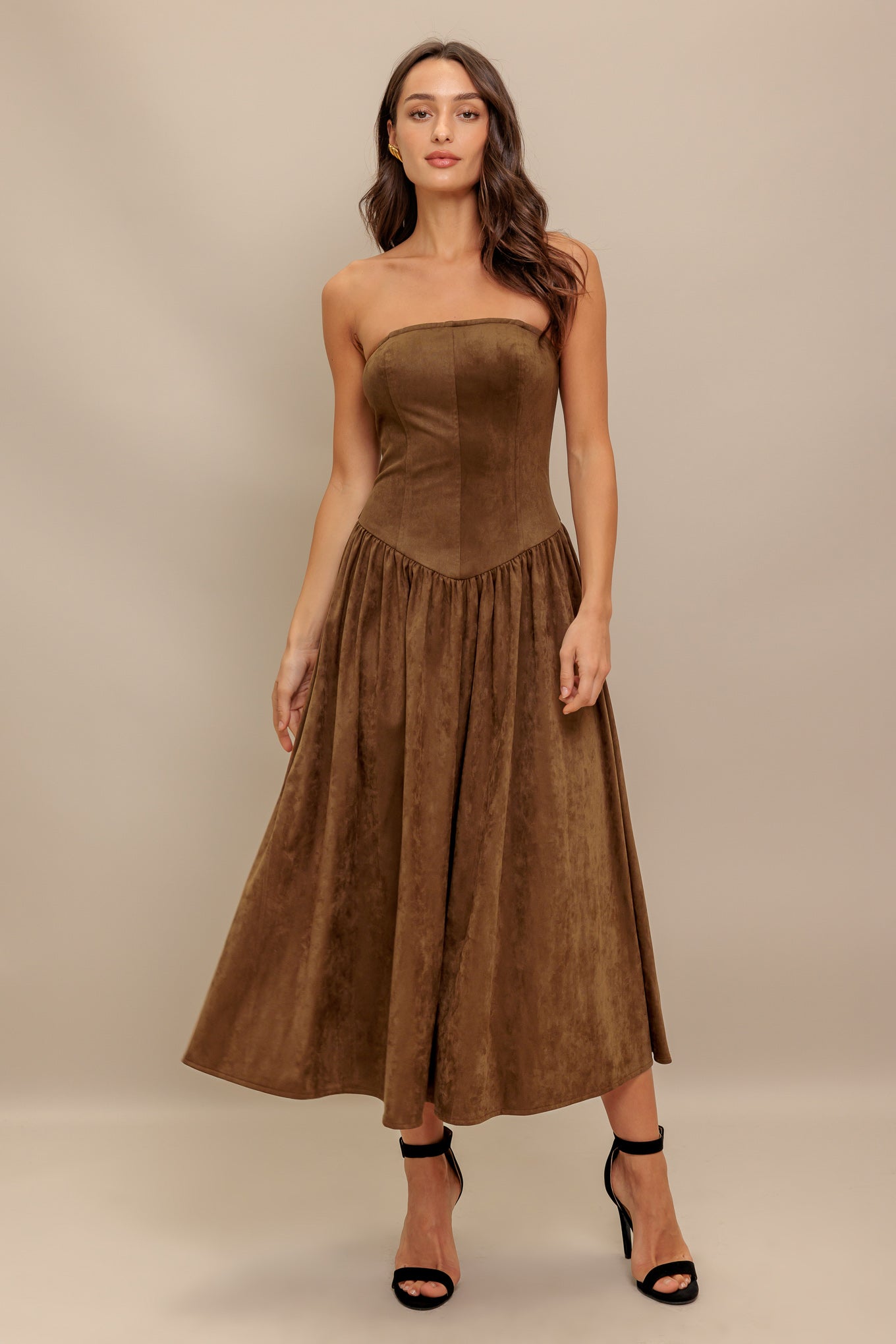A faux suede midi dress featuring strapless, basque waistline full skirt and back zipper closure