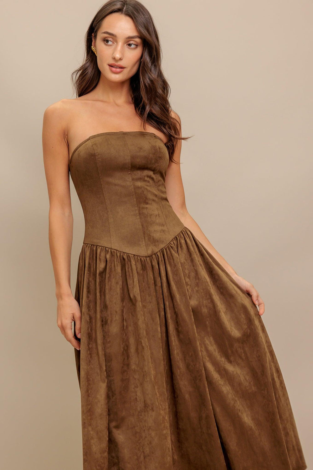 A faux suede midi dress featuring strapless, basque waistline full skirt and back zipper closure