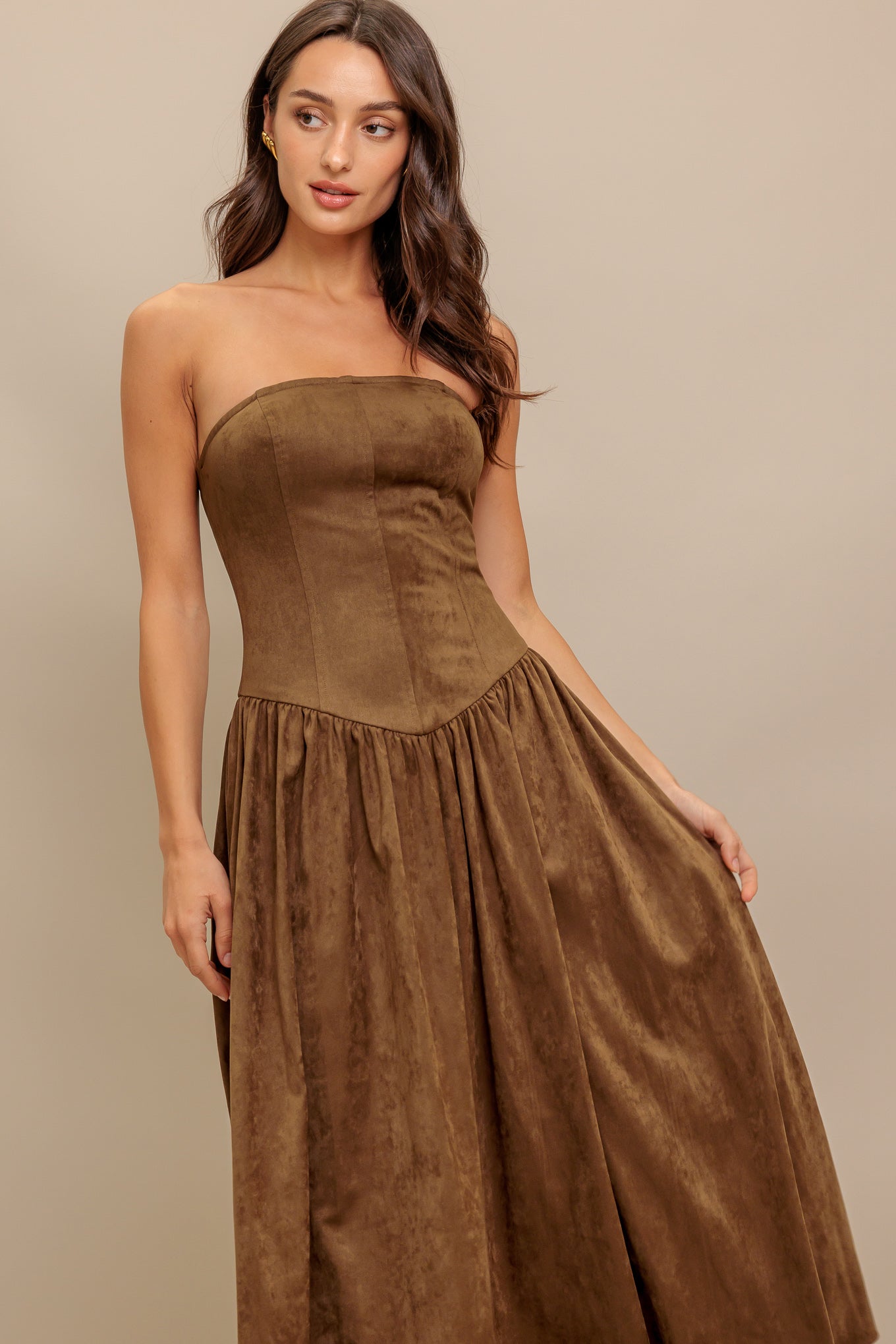 A faux suede midi dress featuring strapless, basque waistline full skirt and back zipper closure