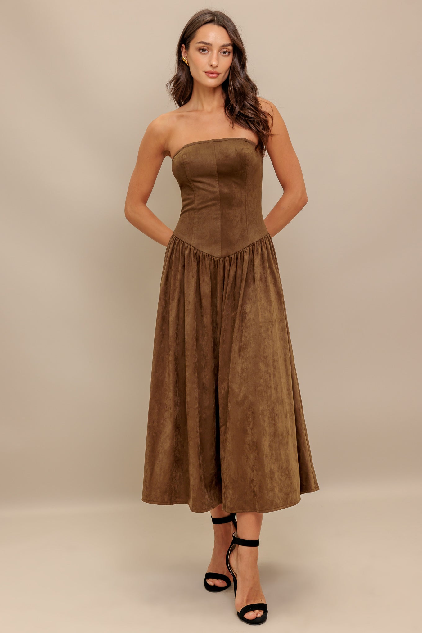 A faux suede midi dress featuring strapless, basque waistline full skirt and back zipper closure