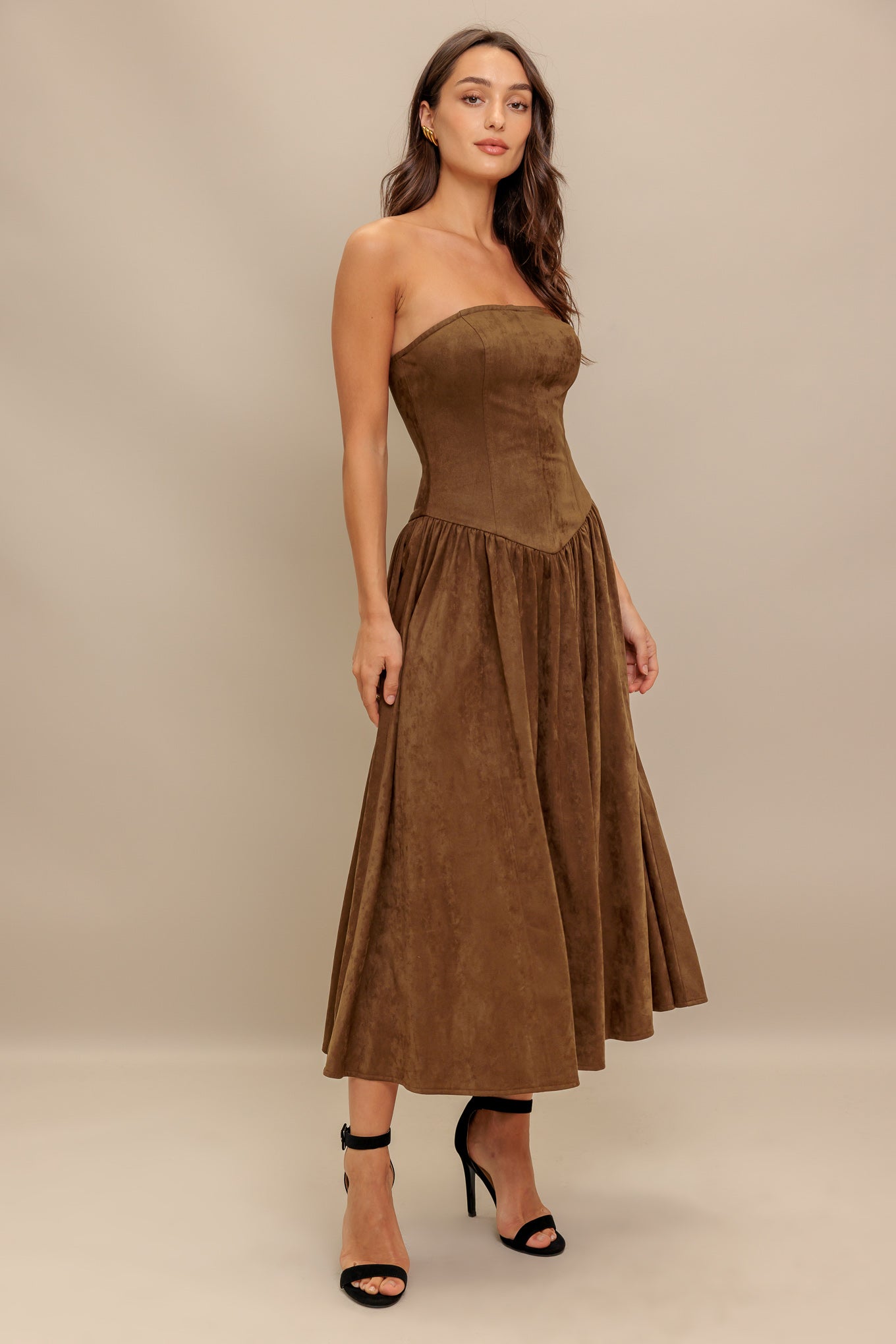 A faux suede midi dress featuring strapless, basque waistline full skirt and back zipper closure