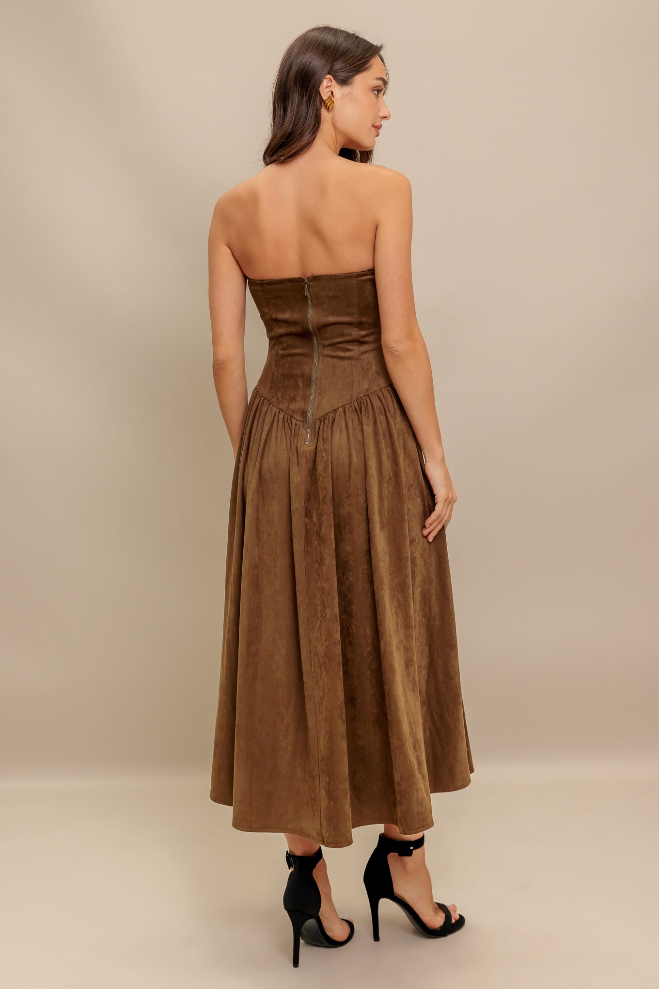 A faux suede midi dress featuring strapless, basque waistline full skirt and back zipper closure