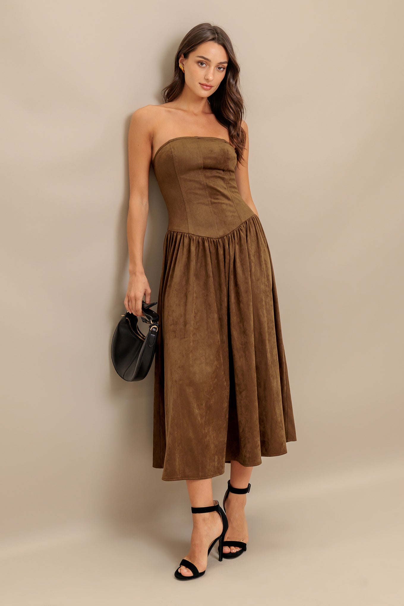 A faux suede midi dress featuring strapless, basque waistline full skirt and back zipper closure