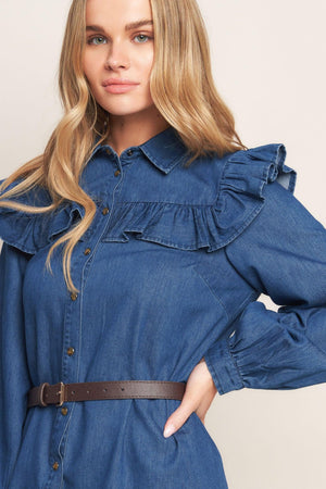 A denim mini dress featuring collar, square yoke with ruffles, long sleeve, front button down and contrasting belt