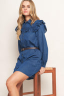 A denim mini dress featuring collar, square yoke with ruffles, long sleeve, front button down and contrasting belt