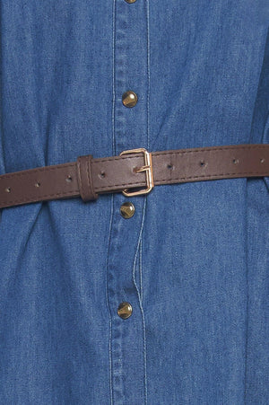 A denim mini dress featuring collar, square yoke with ruffles, long sleeve, front button down and contrasting belt