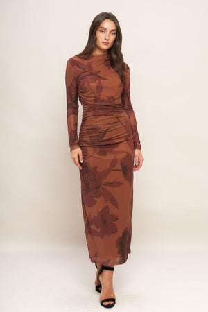A printed power mesh midi dress featuring long sleeve, side shirring and back zipper closure