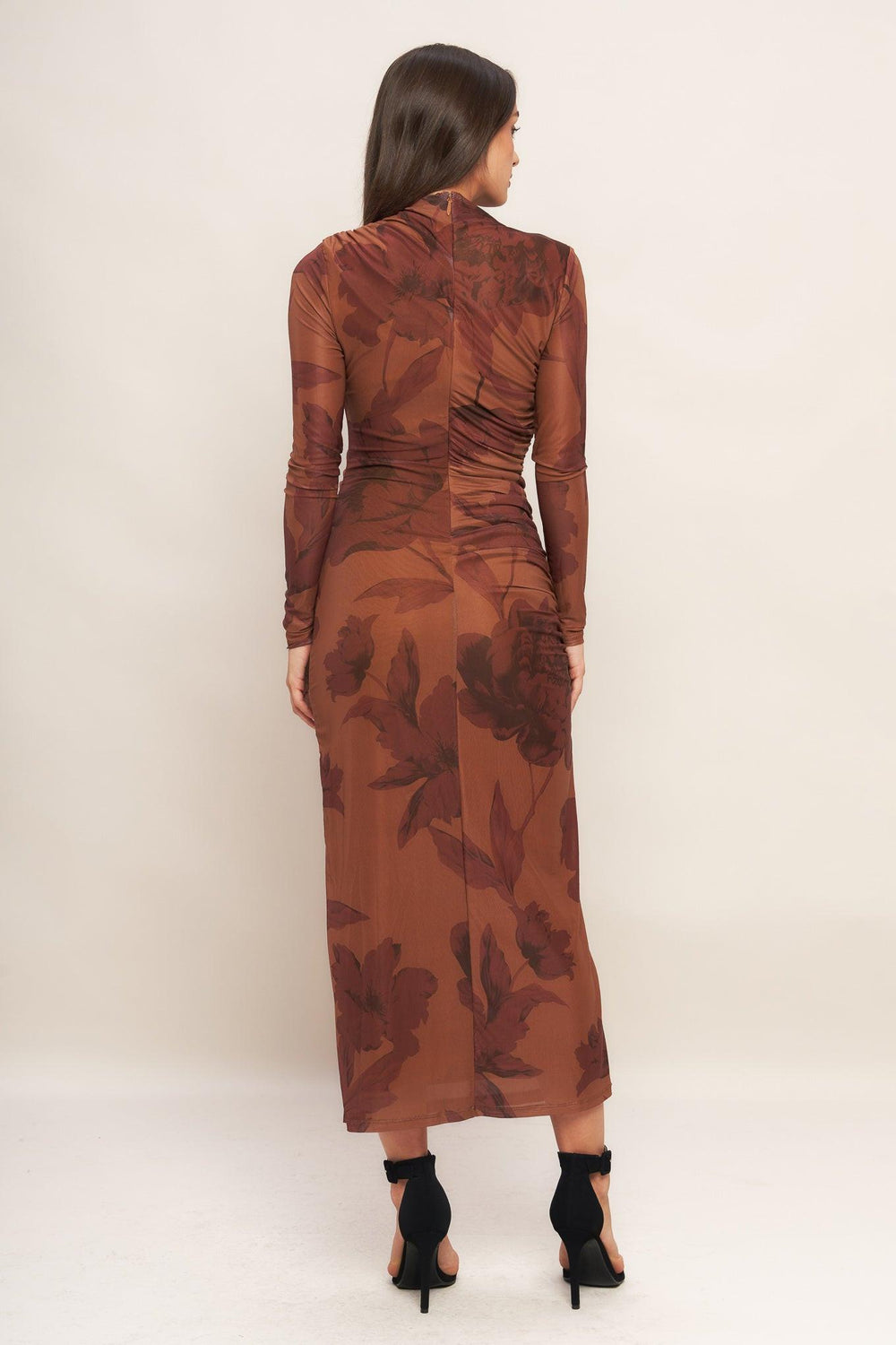 A printed power mesh midi dress featuring long sleeve, side shirring and back zipper closure