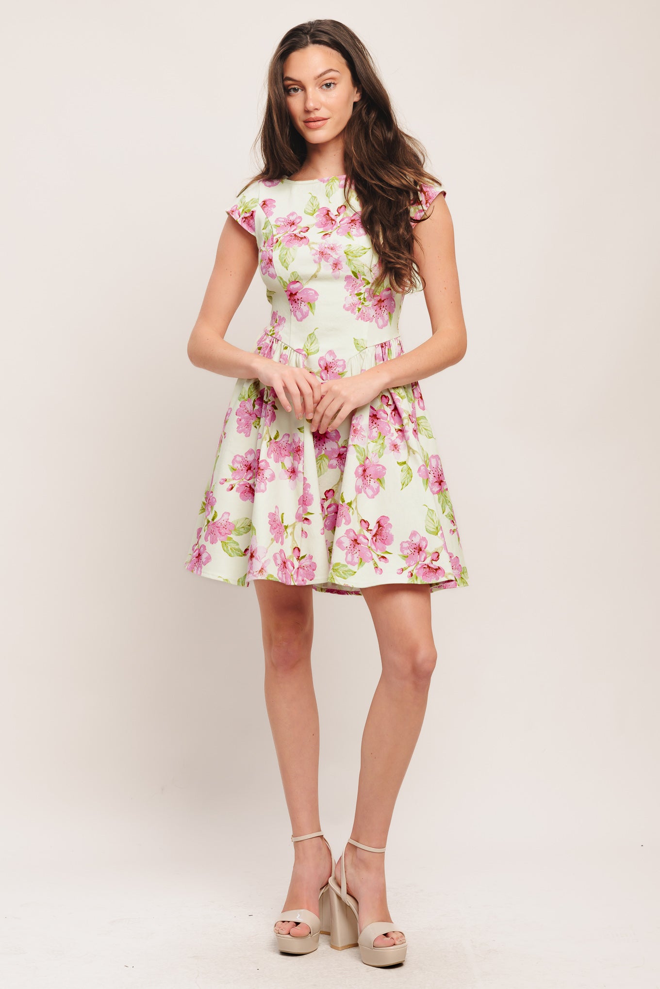 A printed woven mini dress featuring wide neckline, cap sleeve, side shirring, full skirt and back zipper closure

Details:

Self: 97% Cotton 3% Spandex

Size & Fit

-Model is 5`8" And Wearing Size Small
-Measurements Taken From Size Small
-Approx. Length: 35"