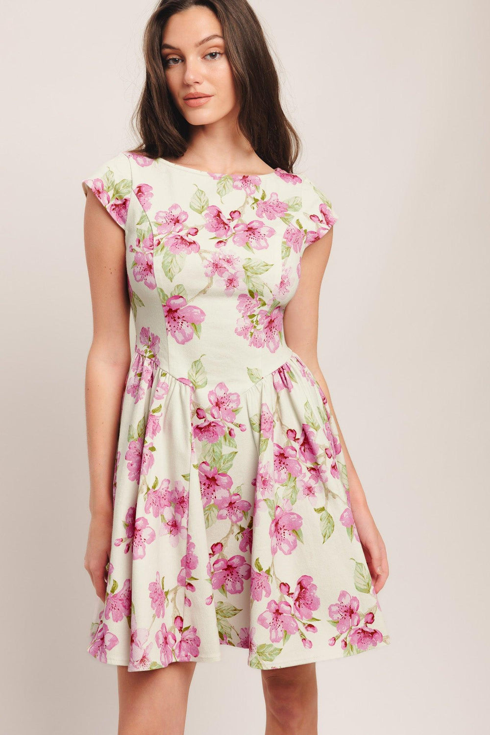 A printed woven mini dress featuring wide neckline, cap sleeve, side shirring, full skirt and back zipper closure

Details:

Self: 97% Cotton 3% Spandex

Size & Fit

-Model is 5`8" And Wearing Size Small
-Measurements Taken From Size Small
-Approx. Length: 35"