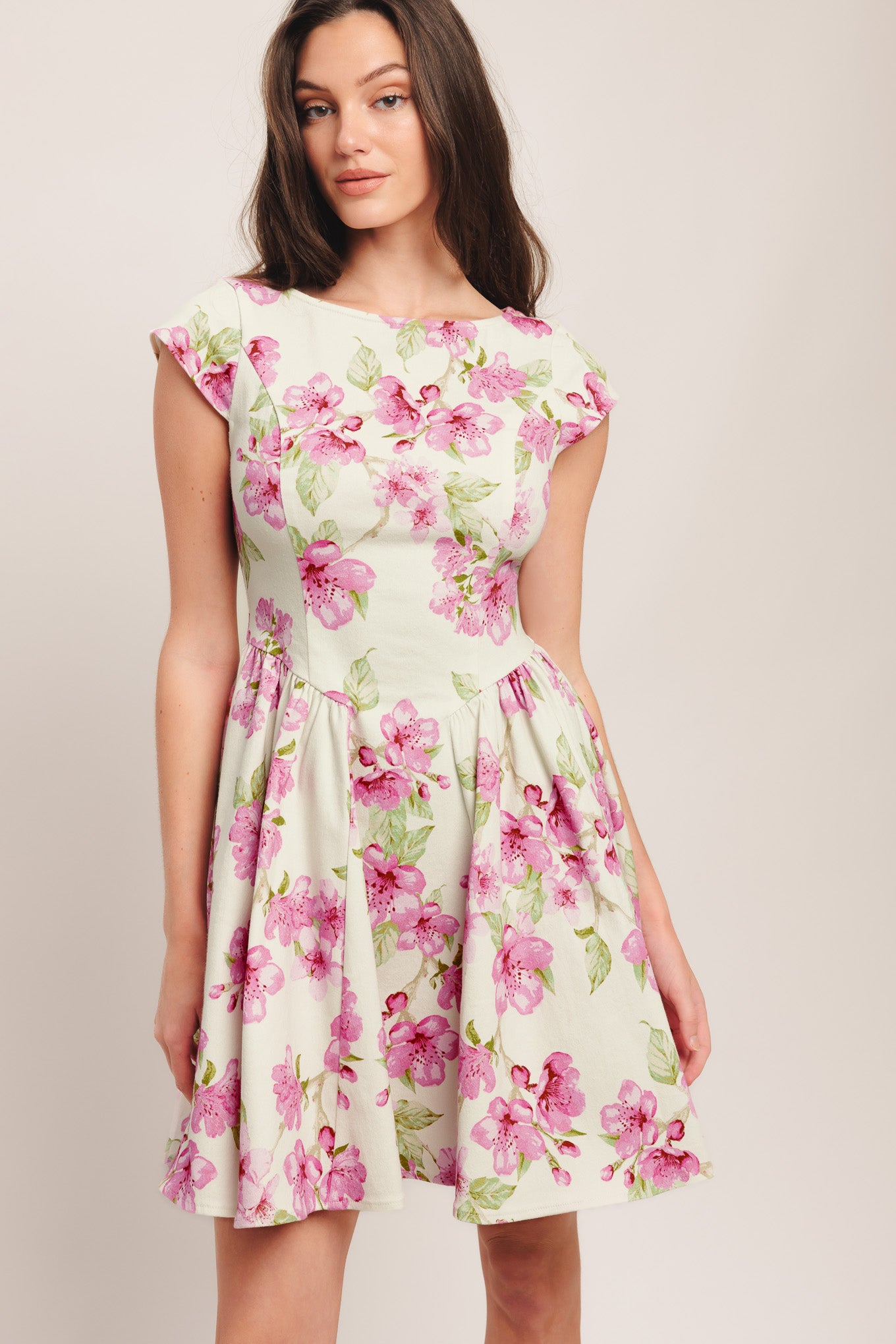 A printed woven mini dress featuring wide neckline, cap sleeve, side shirring, full skirt and back zipper closure

Details:

Self: 97% Cotton 3% Spandex

Size & Fit

-Model is 5`8" And Wearing Size Small
-Measurements Taken From Size Small
-Approx. Length: 35"