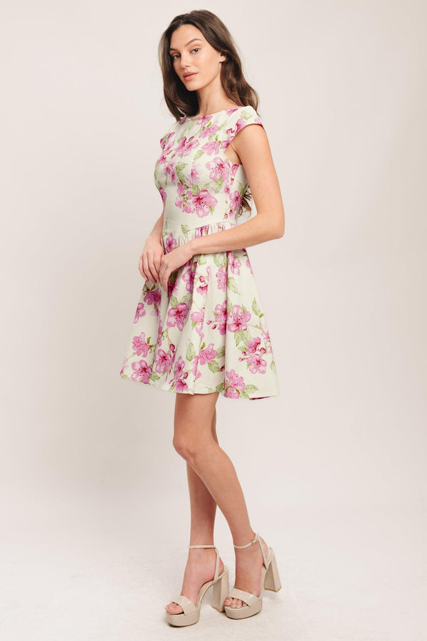 A printed woven mini dress featuring wide neckline, cap sleeve, side shirring, full skirt and back zipper closure

Details:

Self: 97% Cotton 3% Spandex

Size & Fit

-Model is 5`8" And Wearing Size Small
-Measurements Taken From Size Small
-Approx. Length: 35"