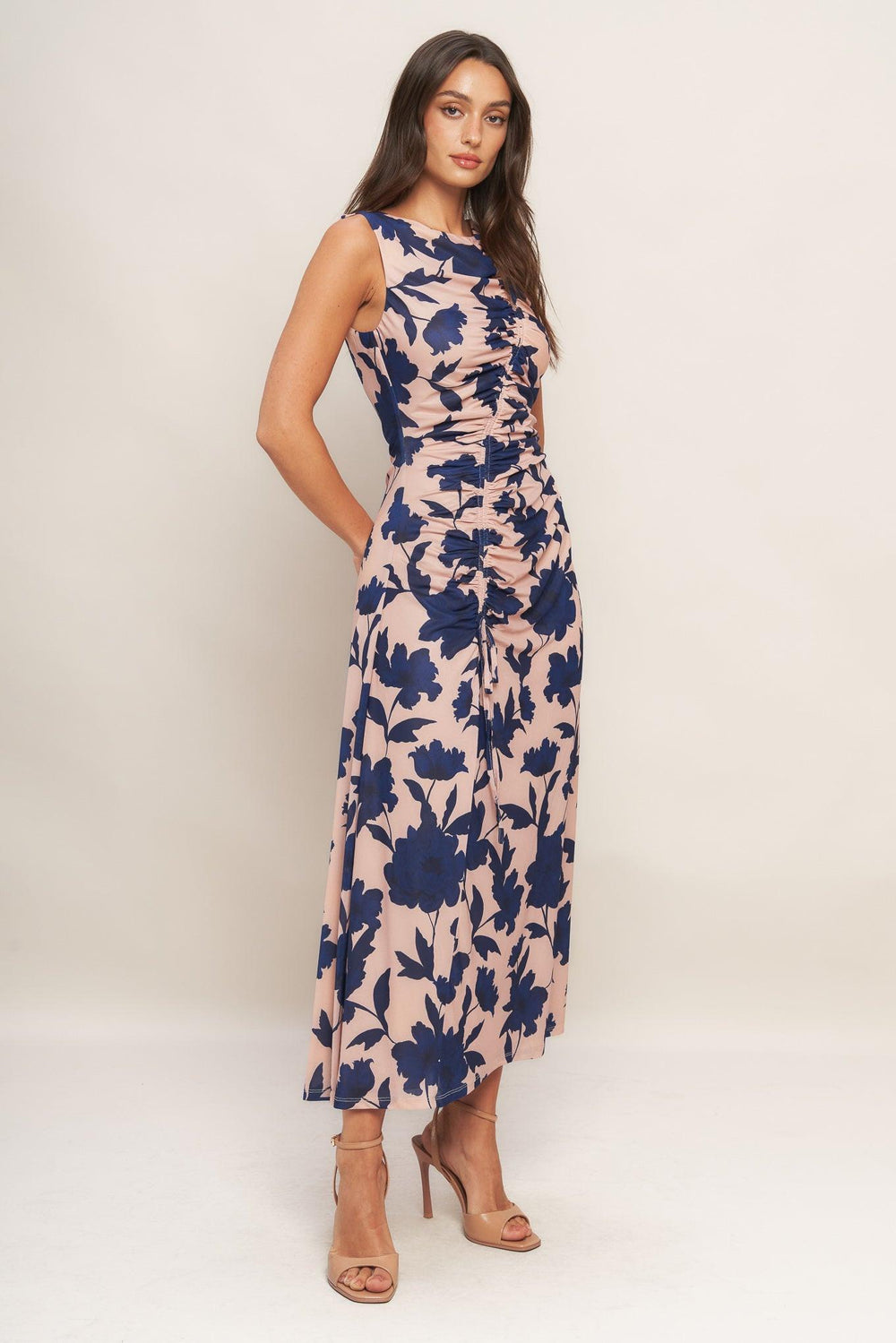 A printed power mesh midi dress featuring boat neckline, sleeveless, shirred body and back zipper closure