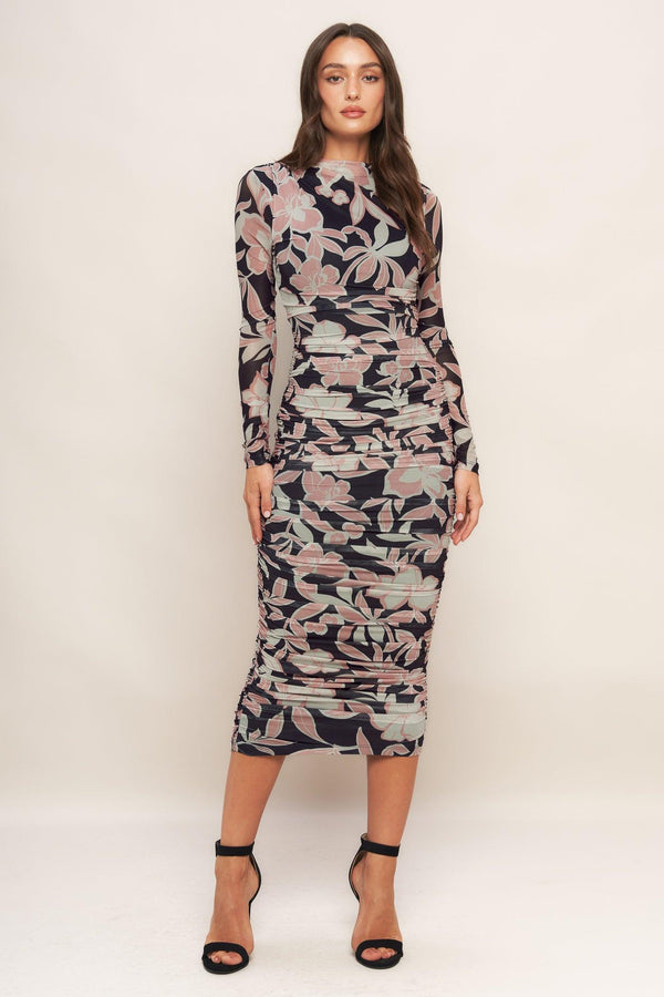 A printed power mesh midi dress featuring body contouring, long sleeve, shirred side and back zipper closure