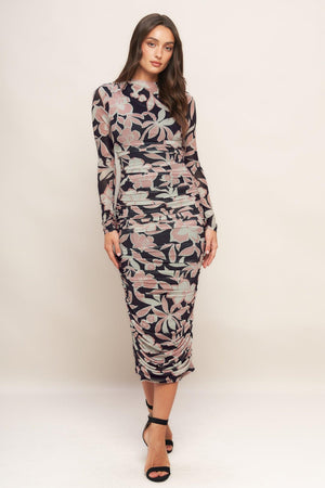 A printed power mesh midi dress featuring body contouring, long sleeve, shirred side and back zipper closure