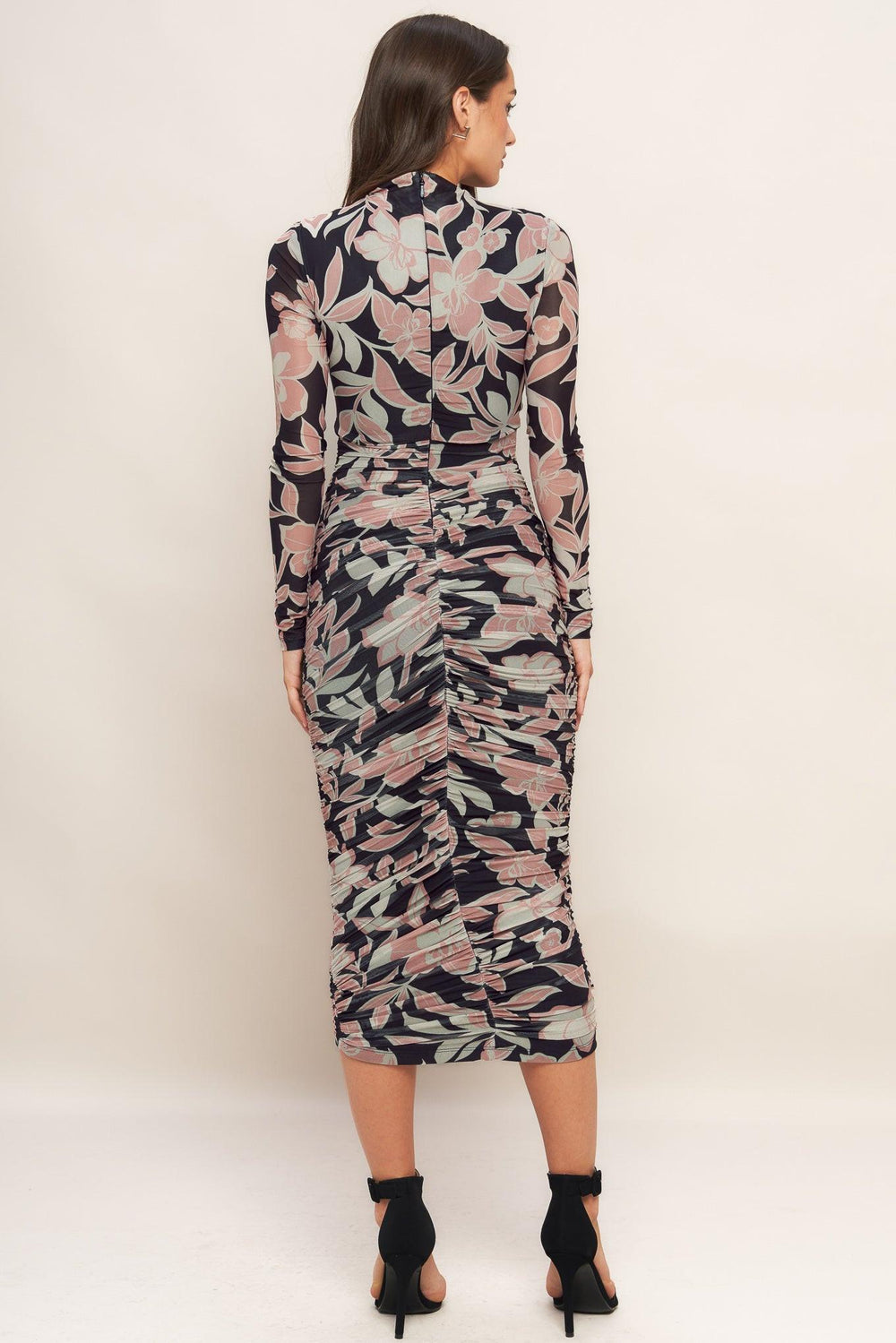 A printed power mesh midi dress featuring body contouring, long sleeve, shirred side and back zipper closure