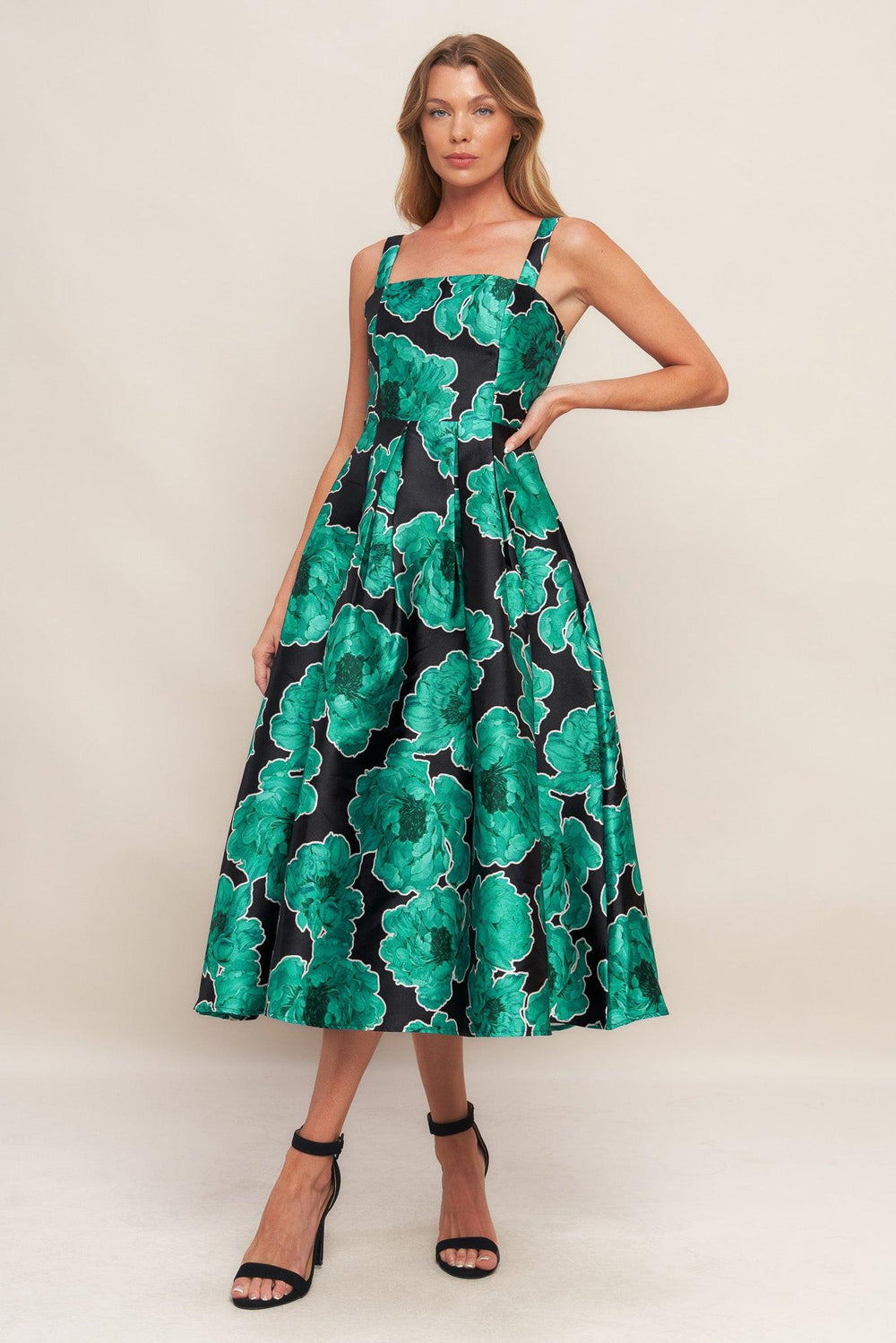 A printed woven midi dress featuring straight neckline, straps, full skirt and back zipper closure