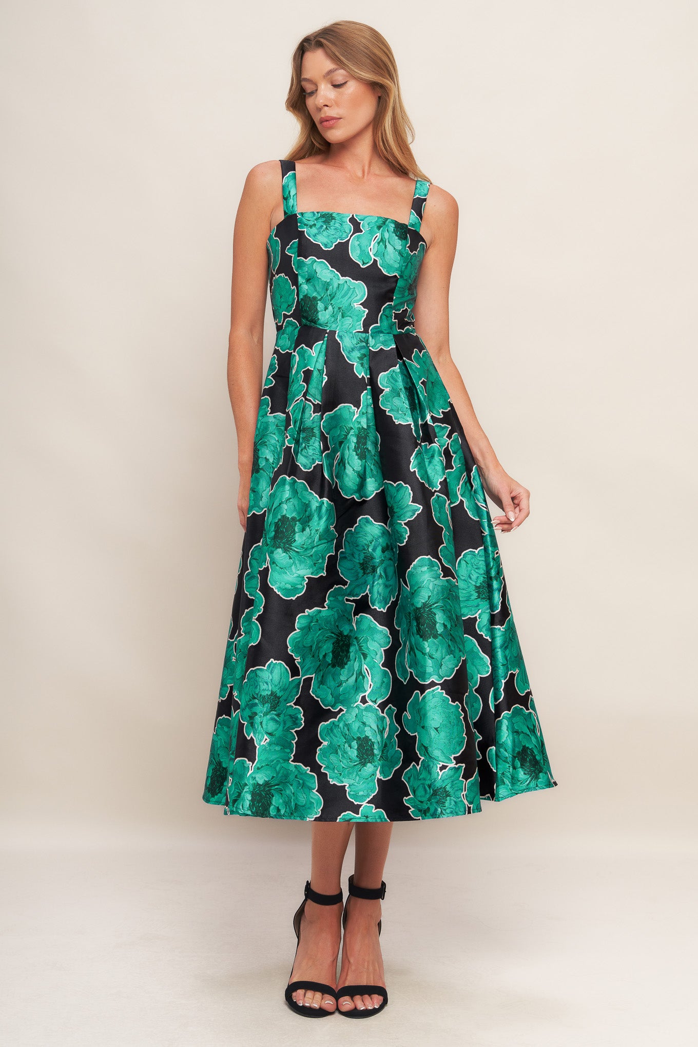 A printed woven midi dress featuring straight neckline, straps, full skirt and back zipper closure