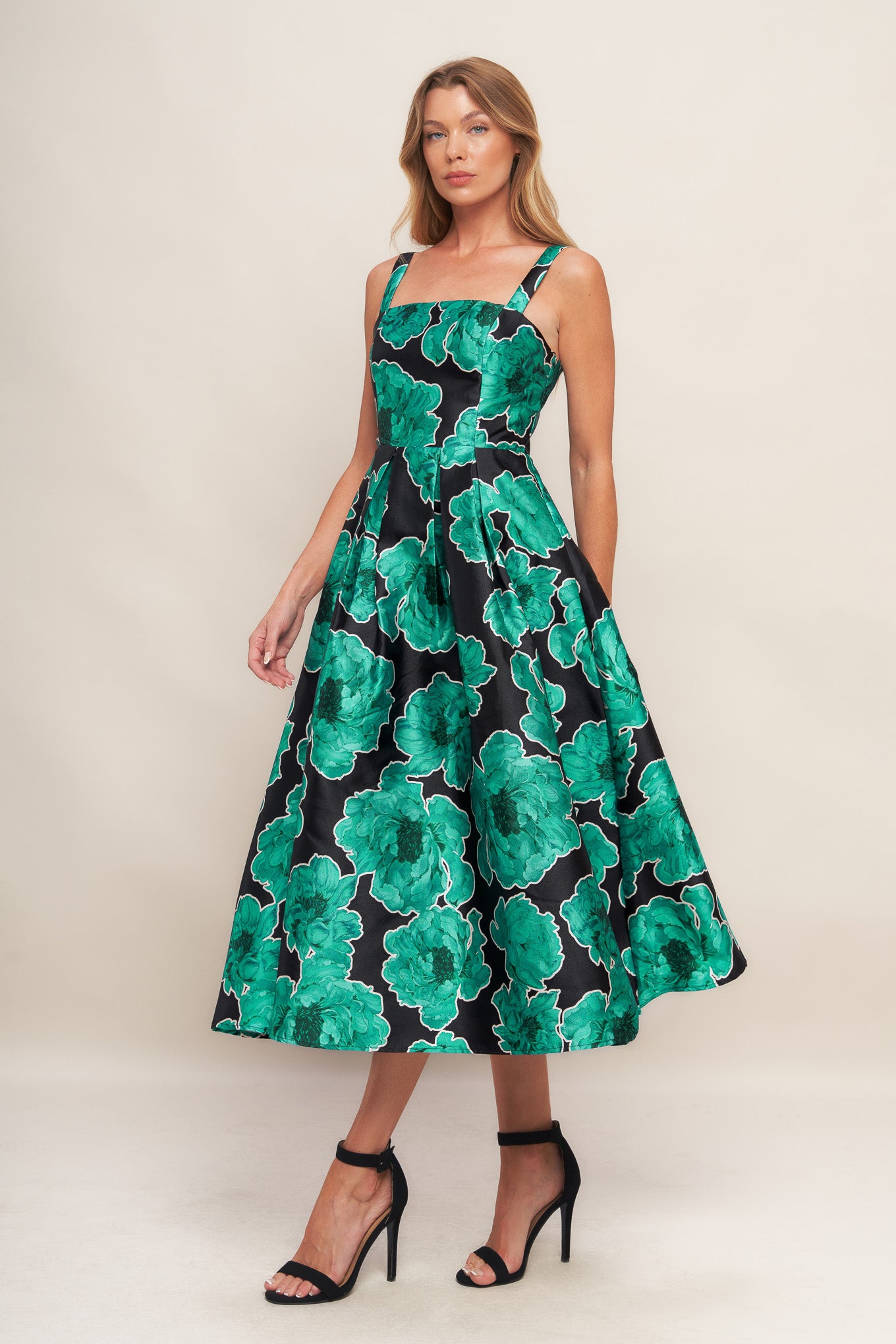 A printed woven midi dress featuring straight neckline, straps, full skirt and back zipper closure