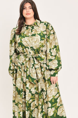 A woman wearing a long-sleeve midi dress with a green and cream floral print | Flying Tomato Curve