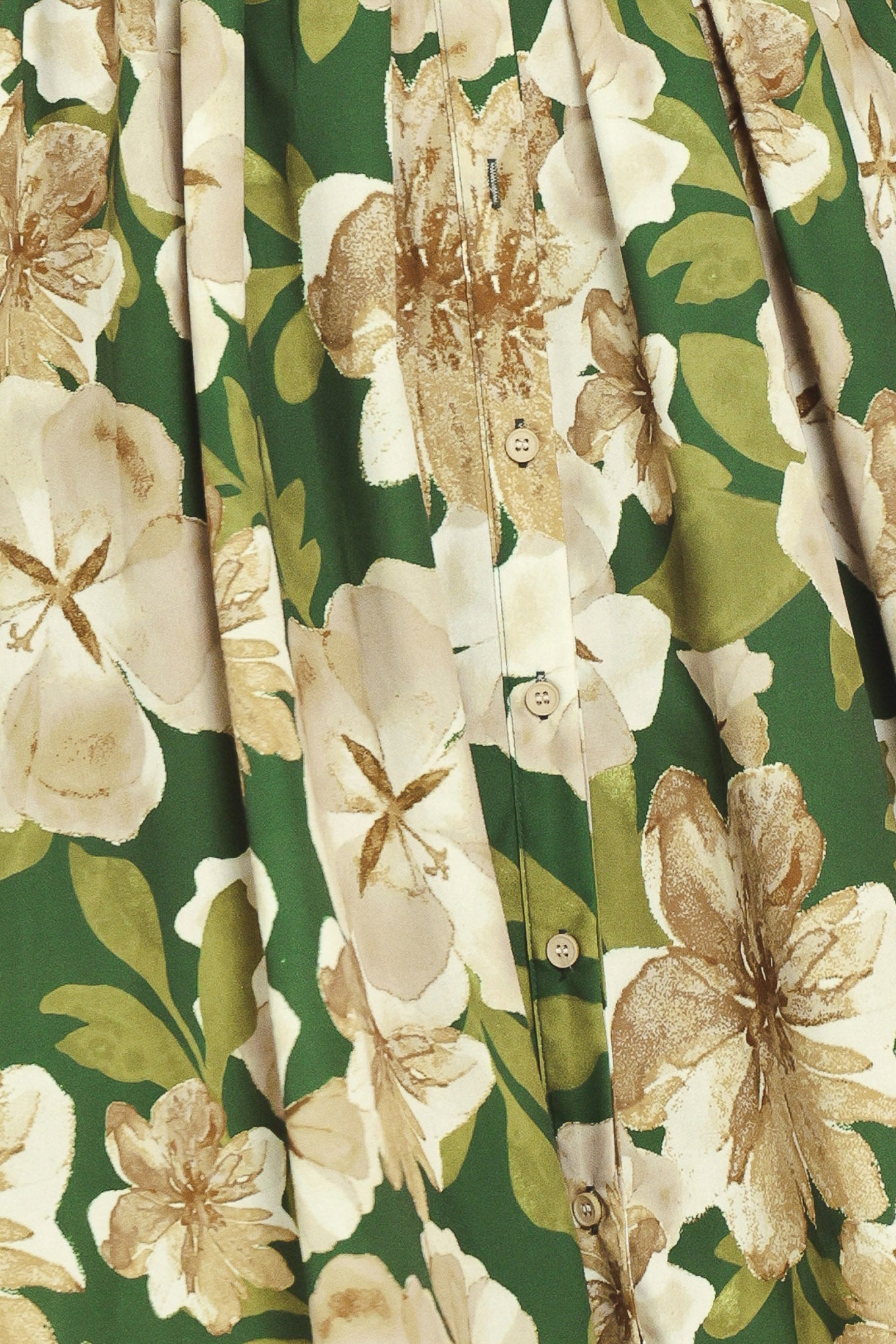 A woman wearing a long-sleeve midi dress with a green and cream floral print | Flying Tomato