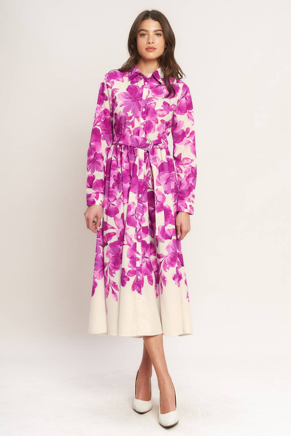 A woman wearing a long-sleeve midi dress with a fuchsia and cream floral print | Flying Tomato