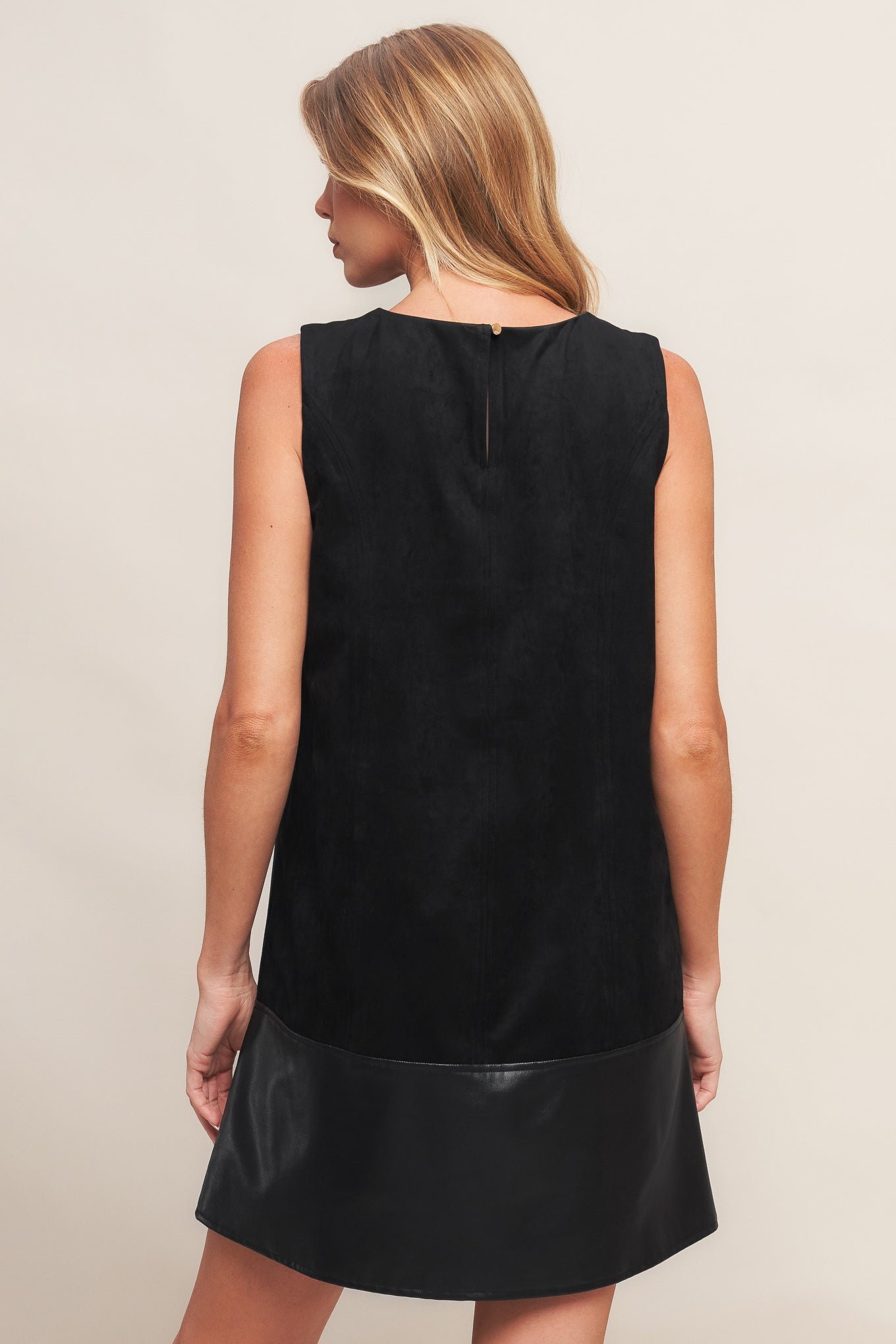 A faux suede and faux leather combination shift dress featuring round neckline, sleeveless and back neck button closure