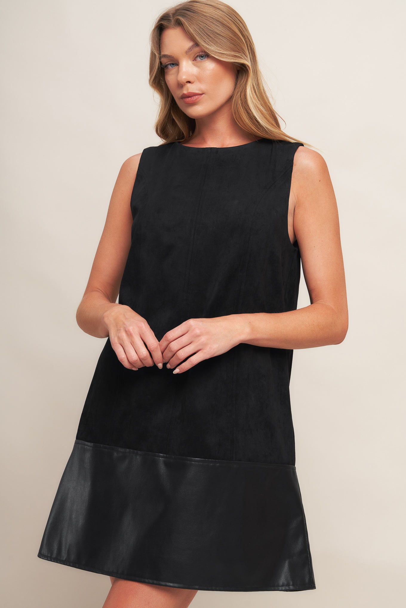 A faux suede and faux leather combination shift dress featuring round neckline, sleeveless and back neck button closure
