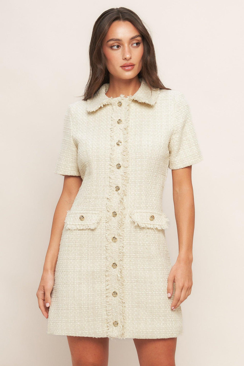 A tweed mini dress featuring frayed collar and placket, short sleeve and button down closure