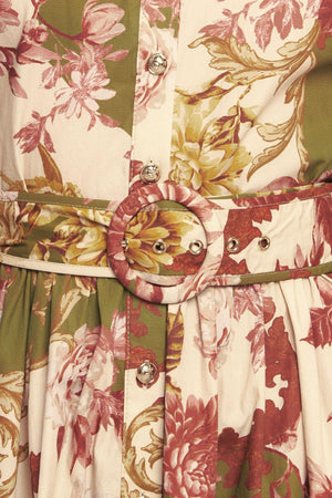 A printed woven midi dress featuring collar, long sleeve with cuff, front button down closure, self belt and full skirt