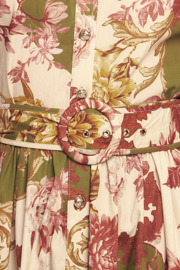 A printed woven midi dress featuring collar, long sleeve with cuff, front button down closure, self belt and full skirt